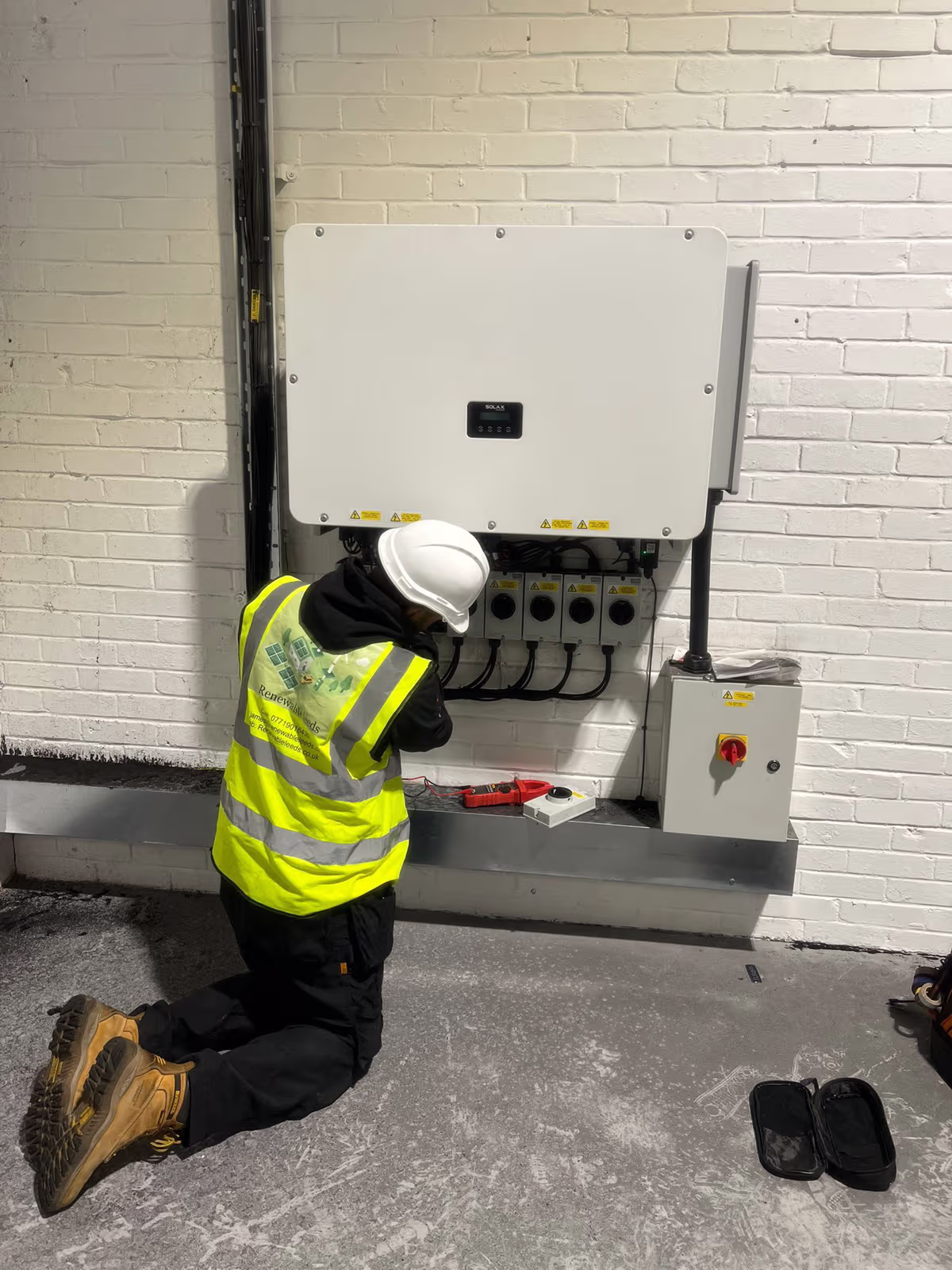Renewable Leeds engineer commissioning an inverter on install day